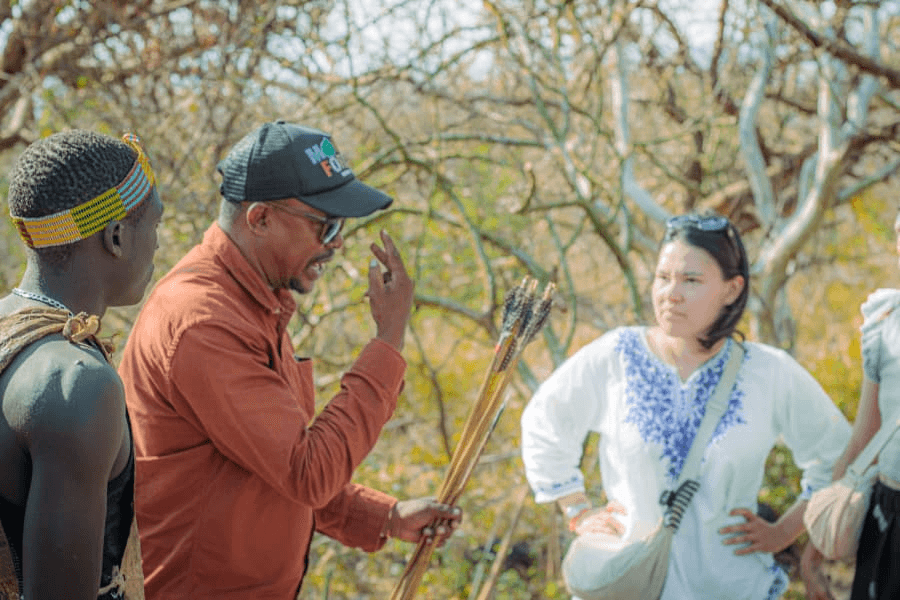 A local guide talking with visitors near Lake Eyasi